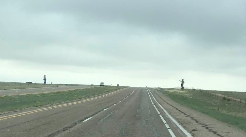 This image has an empty alt attribute; its file name is rv-men-statues-on-road.jpg